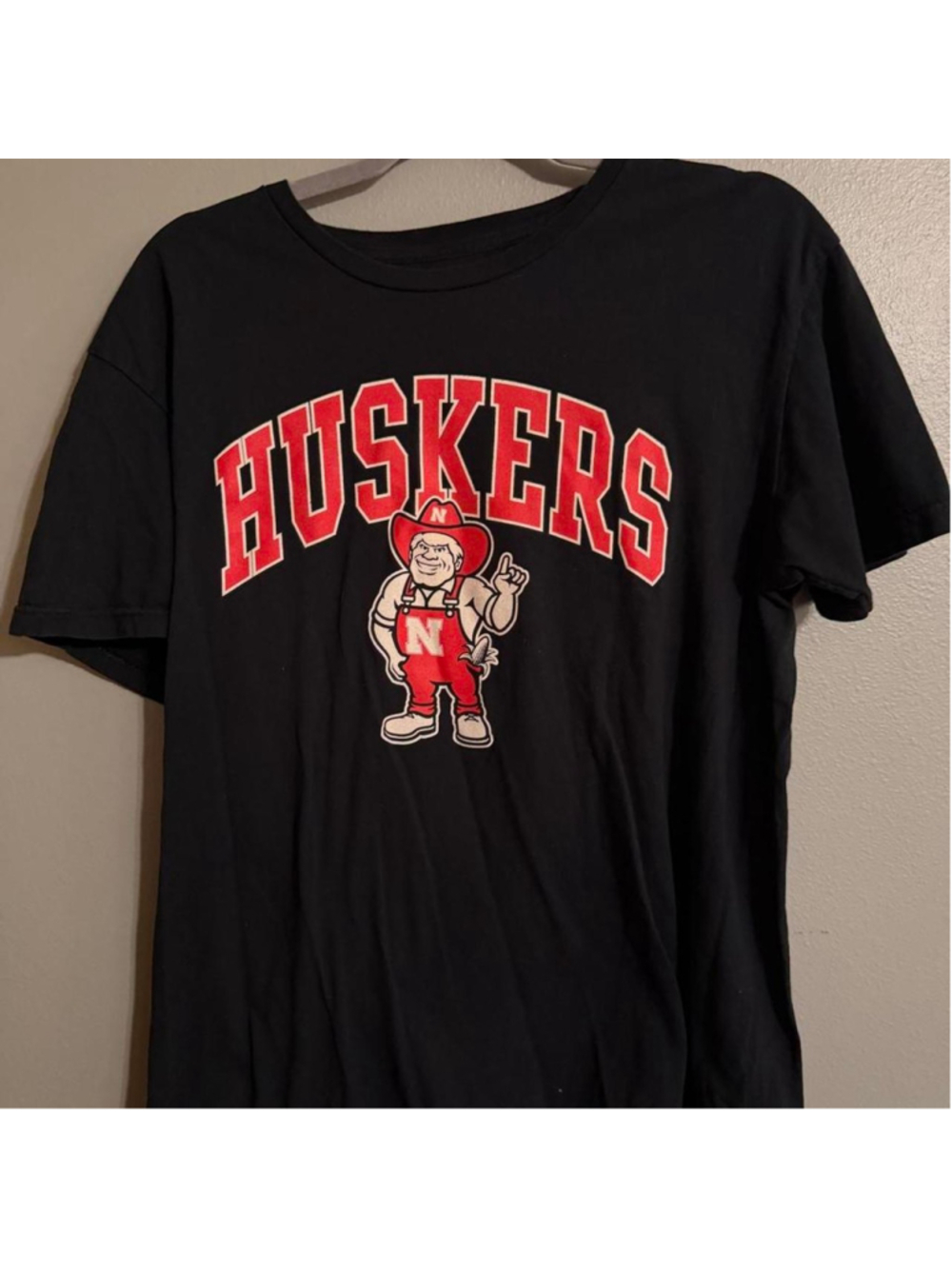 Nebraska Cornhuskers Russell Athletic graphic tee featuring bold HUSKERS collegi